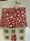 Large squat porcelain table-lamp house, trailing hearts, red