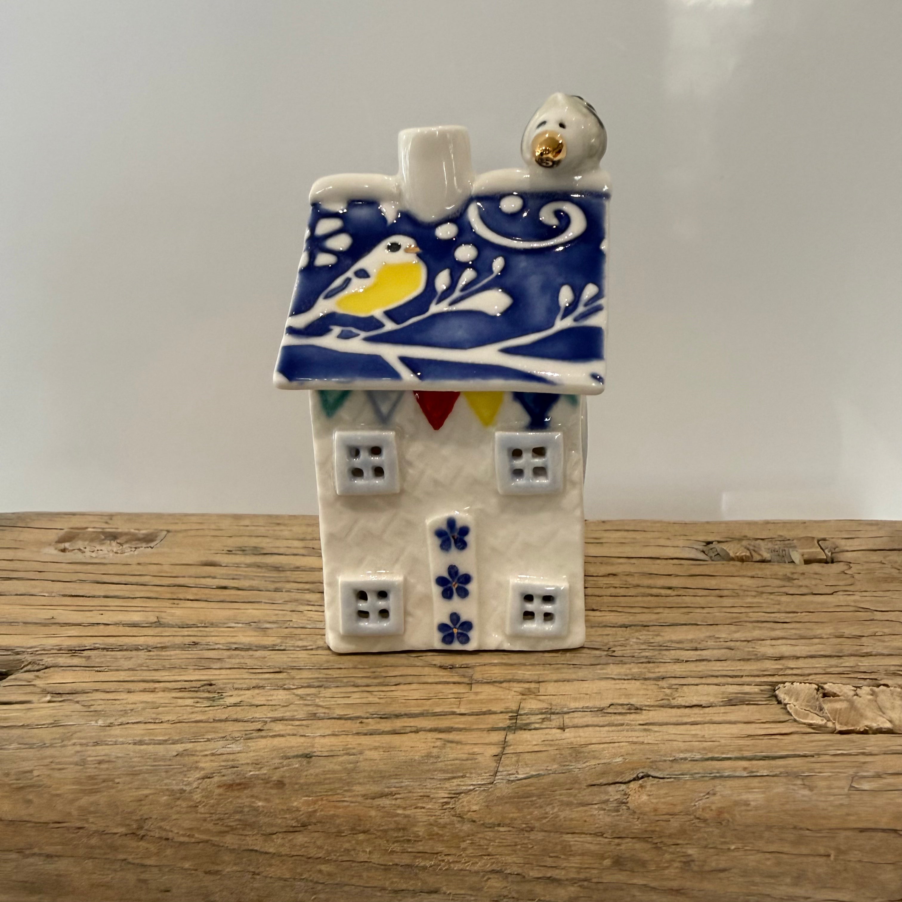 Small porcelain tea-light house, blue tits, cobalt with gold detail