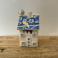 Small porcelain tea-light house, blue tits, bright blue with gold detail