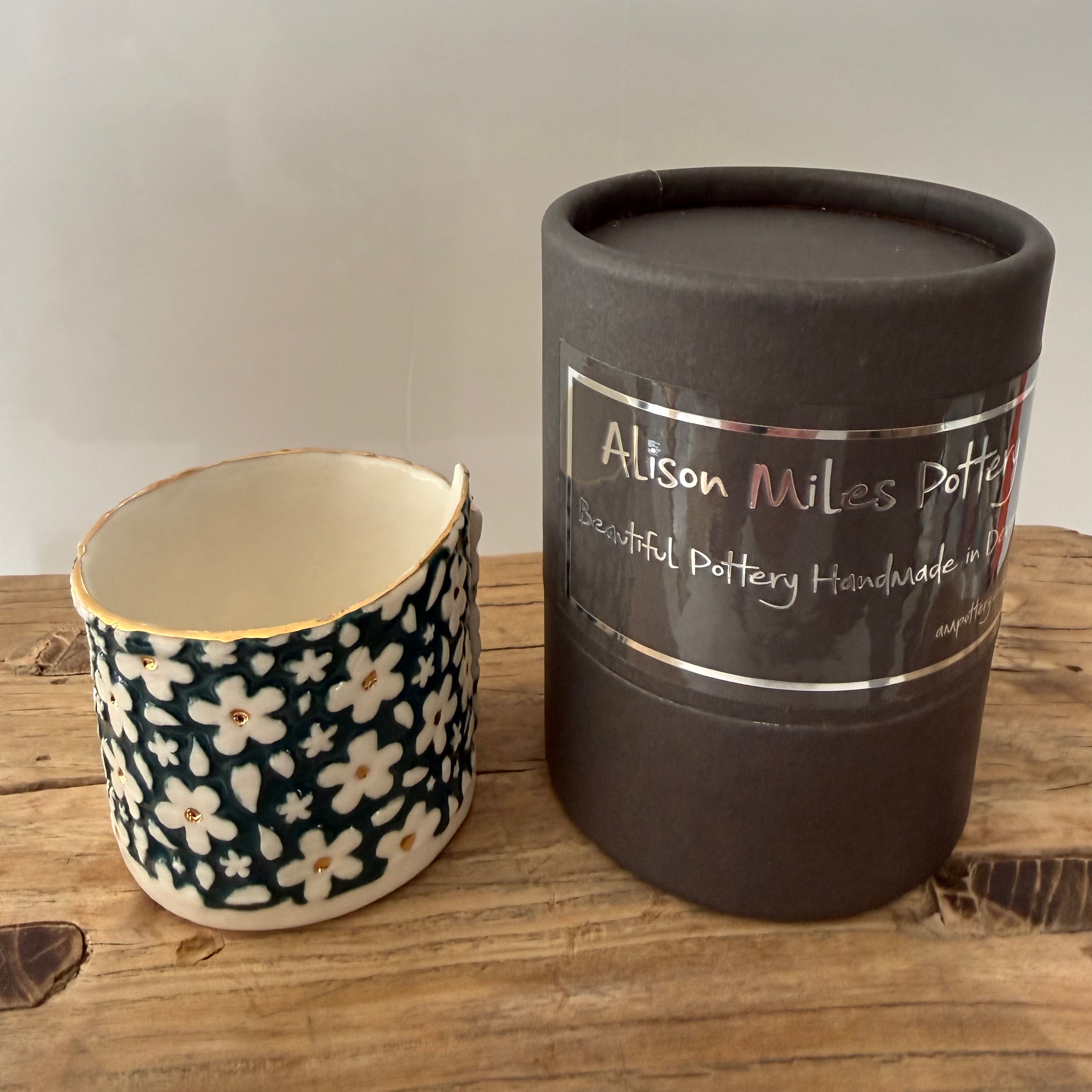Porcelain tea-light holder, daisies, peacock with gold detail