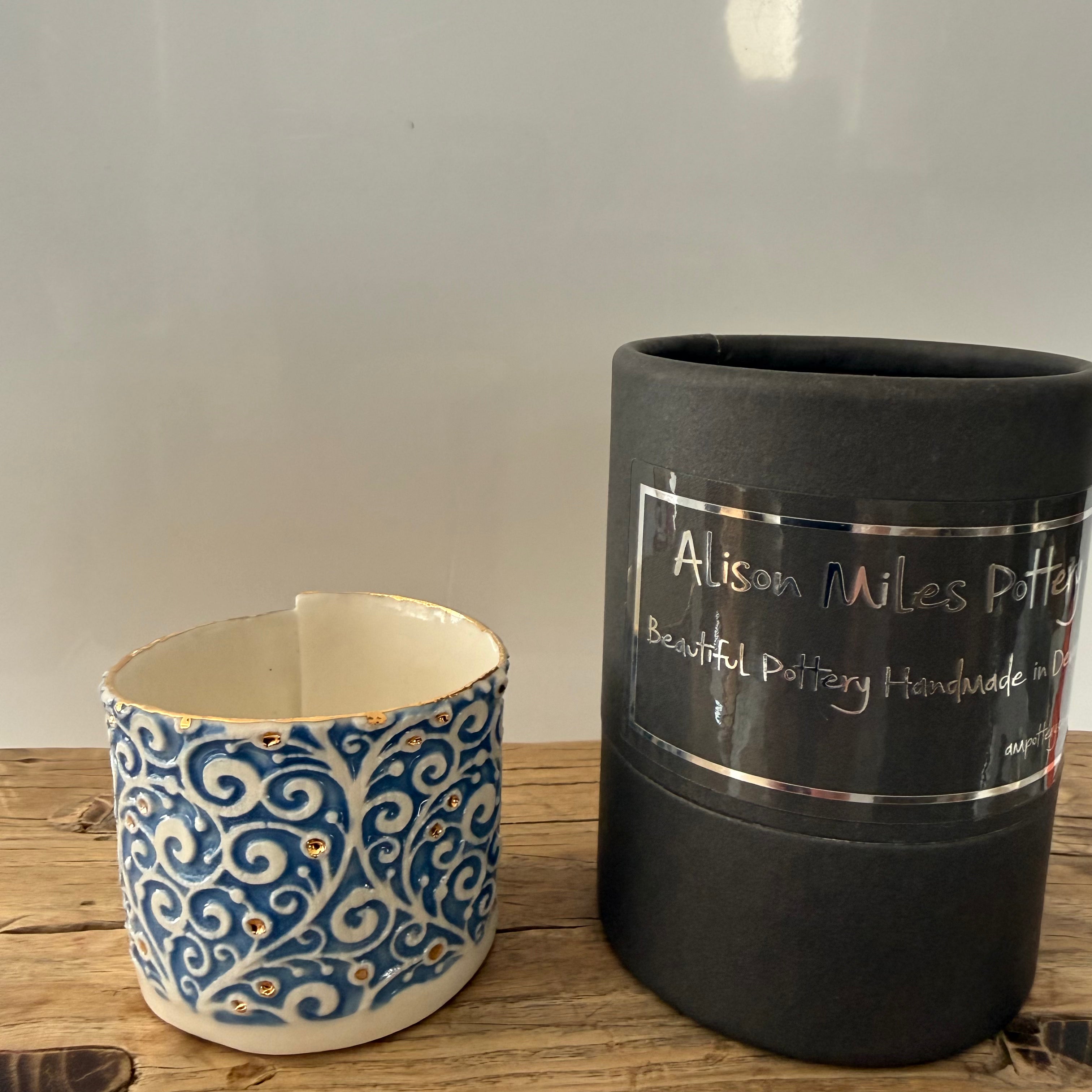 Porcelain tea-light holder, swirls, bright blue with gold detail