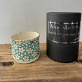 Porcelain tea-light holder, daisies, turquoise with gold detail