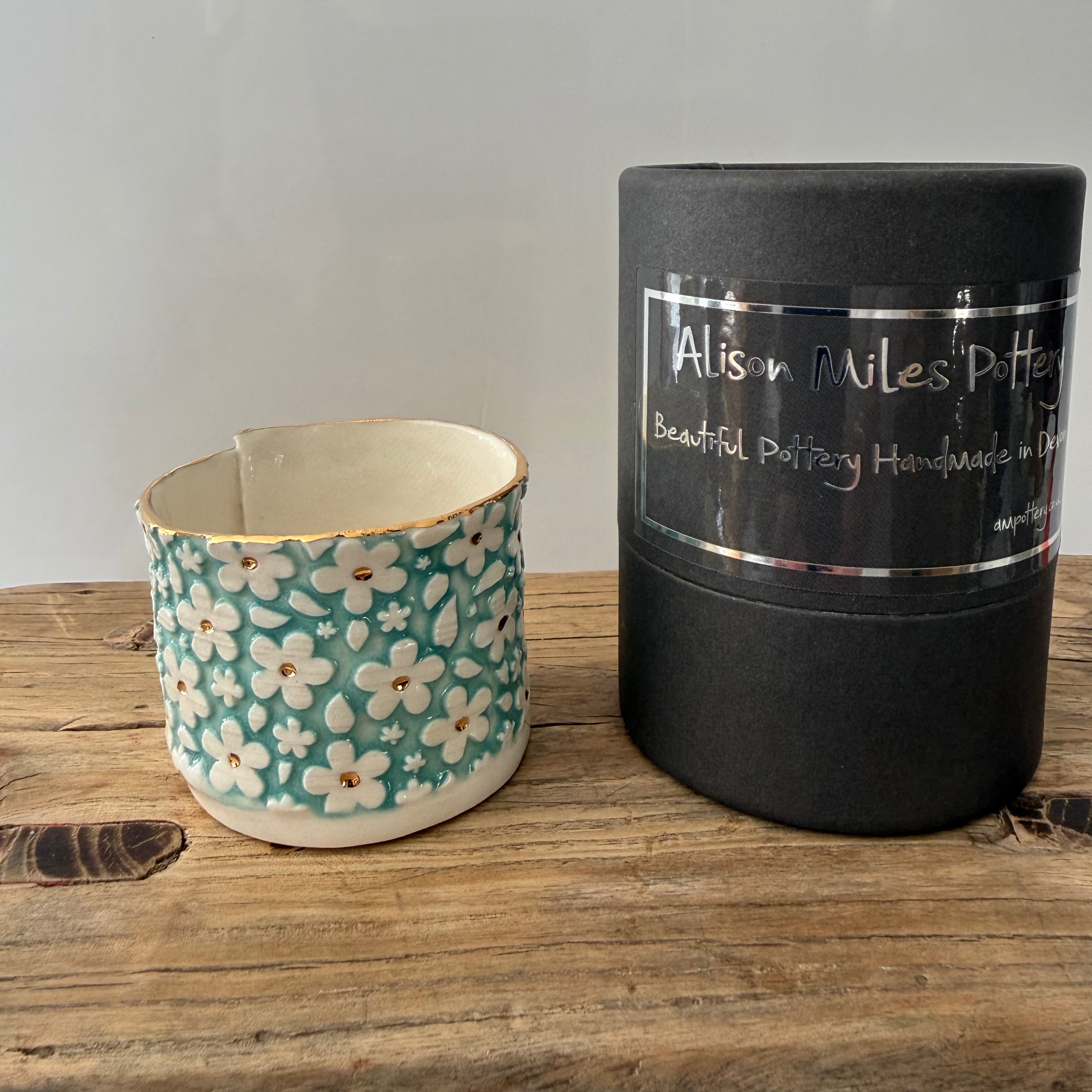 Porcelain tea-light holder, daisies, turquoise with gold detail