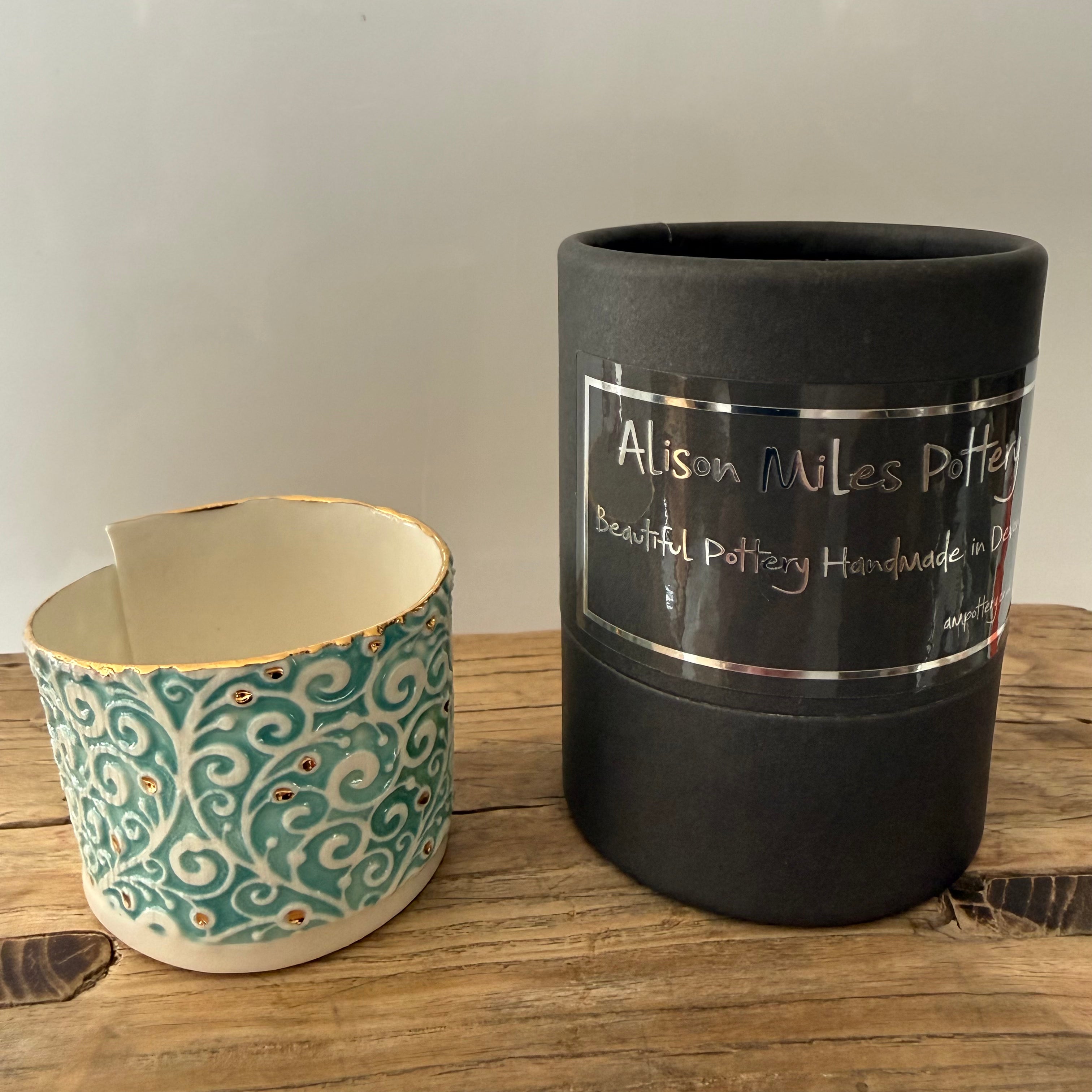 Porcelain tea-light holder, swirls, turquoise with gold detail