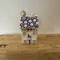 Small porcelain tea-light house, daisies, cobalt with gold detail