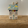 Small porcelain tea-light house, blue tits, turquoise with gold detail