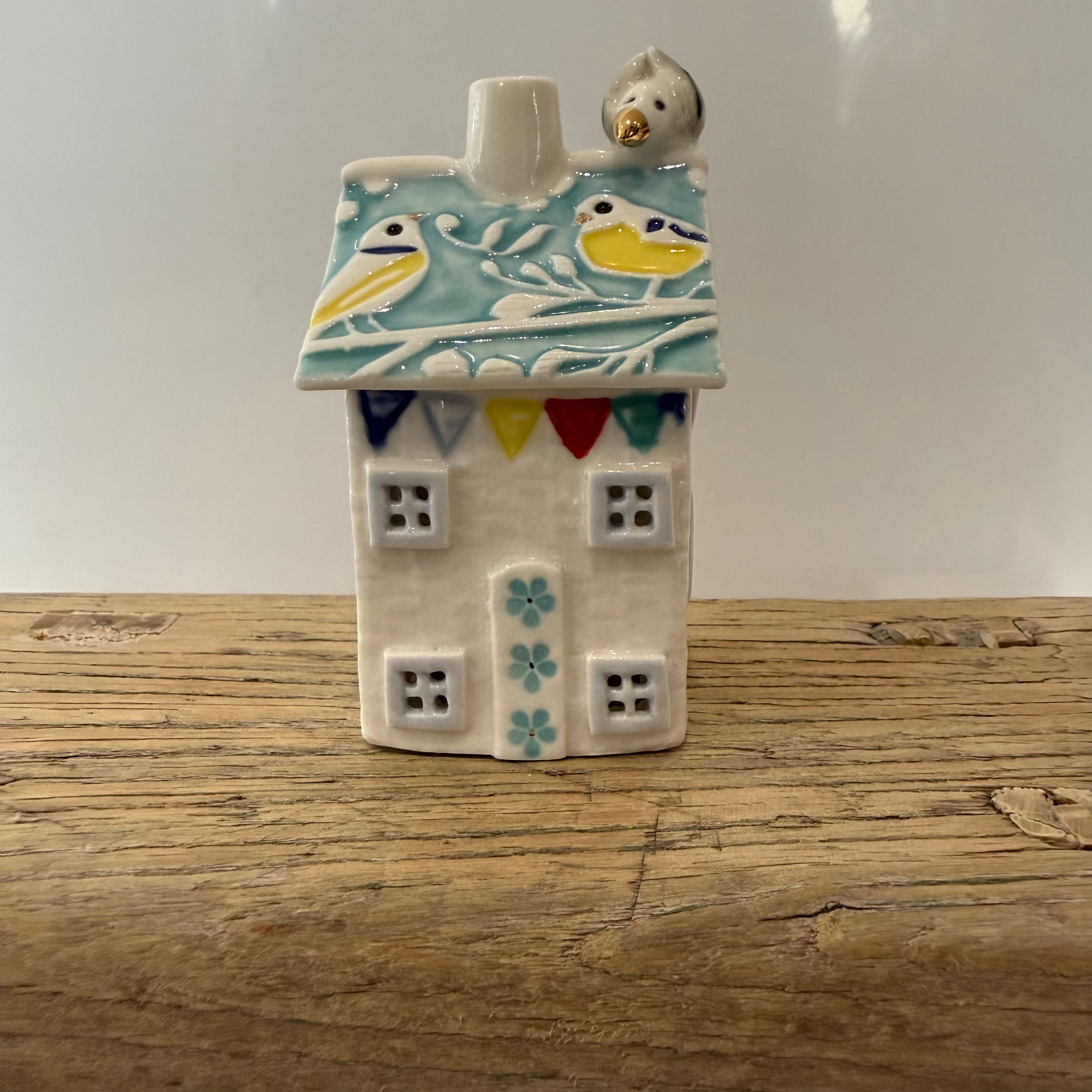 Small porcelain tea-light house, blue tits, turquoise with gold detail
