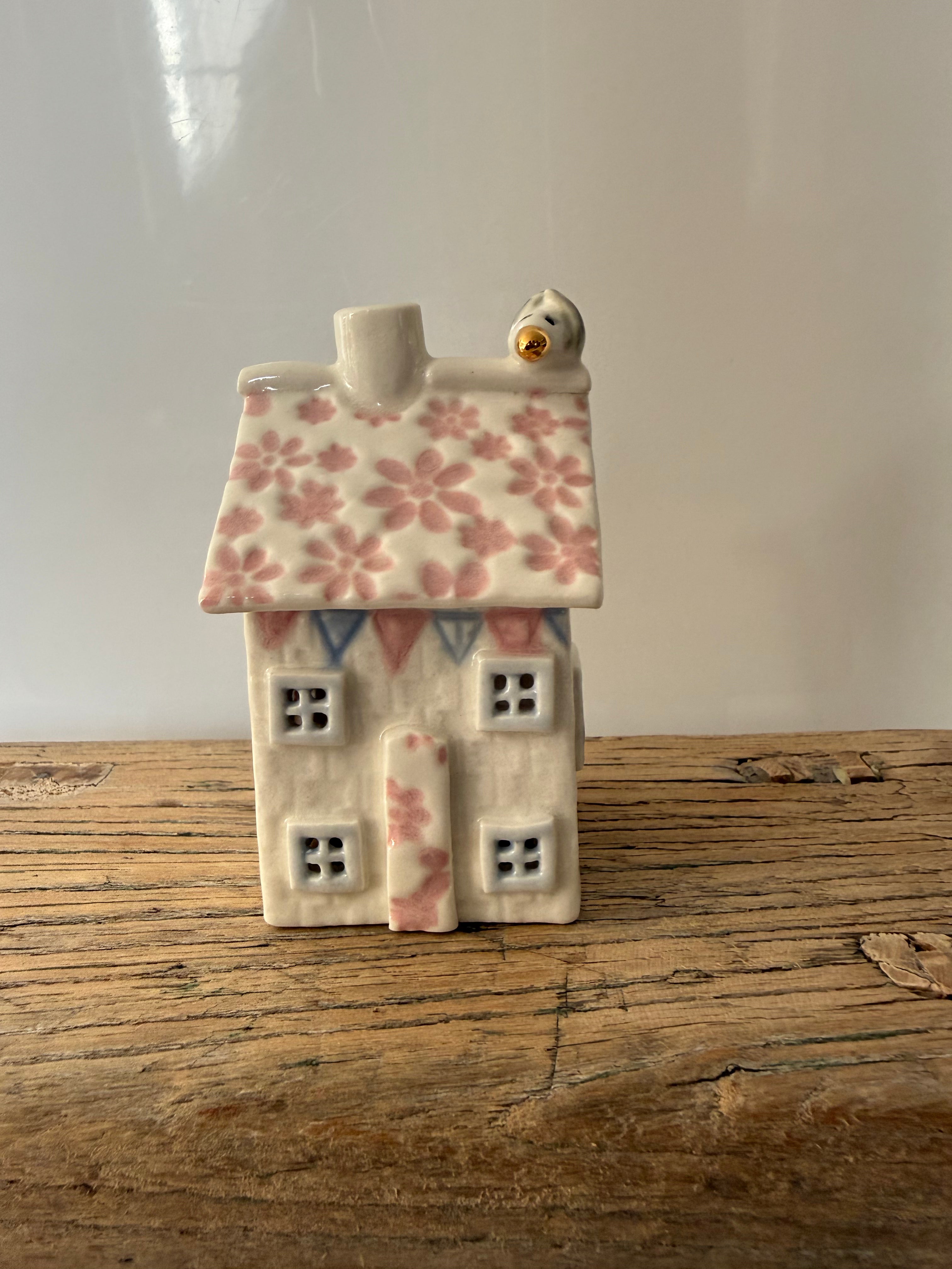 Small porcelain tea-light house, daisies 1, pink with pastel and gold detail